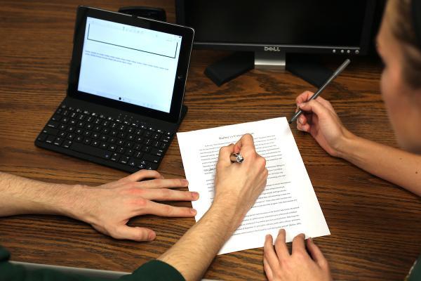 Two students working on a paper.
